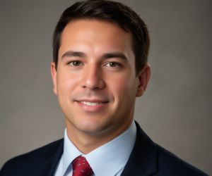 Professional headshot of company team member in work attire